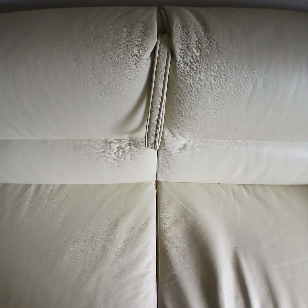 Sillón cama con patas cromadas